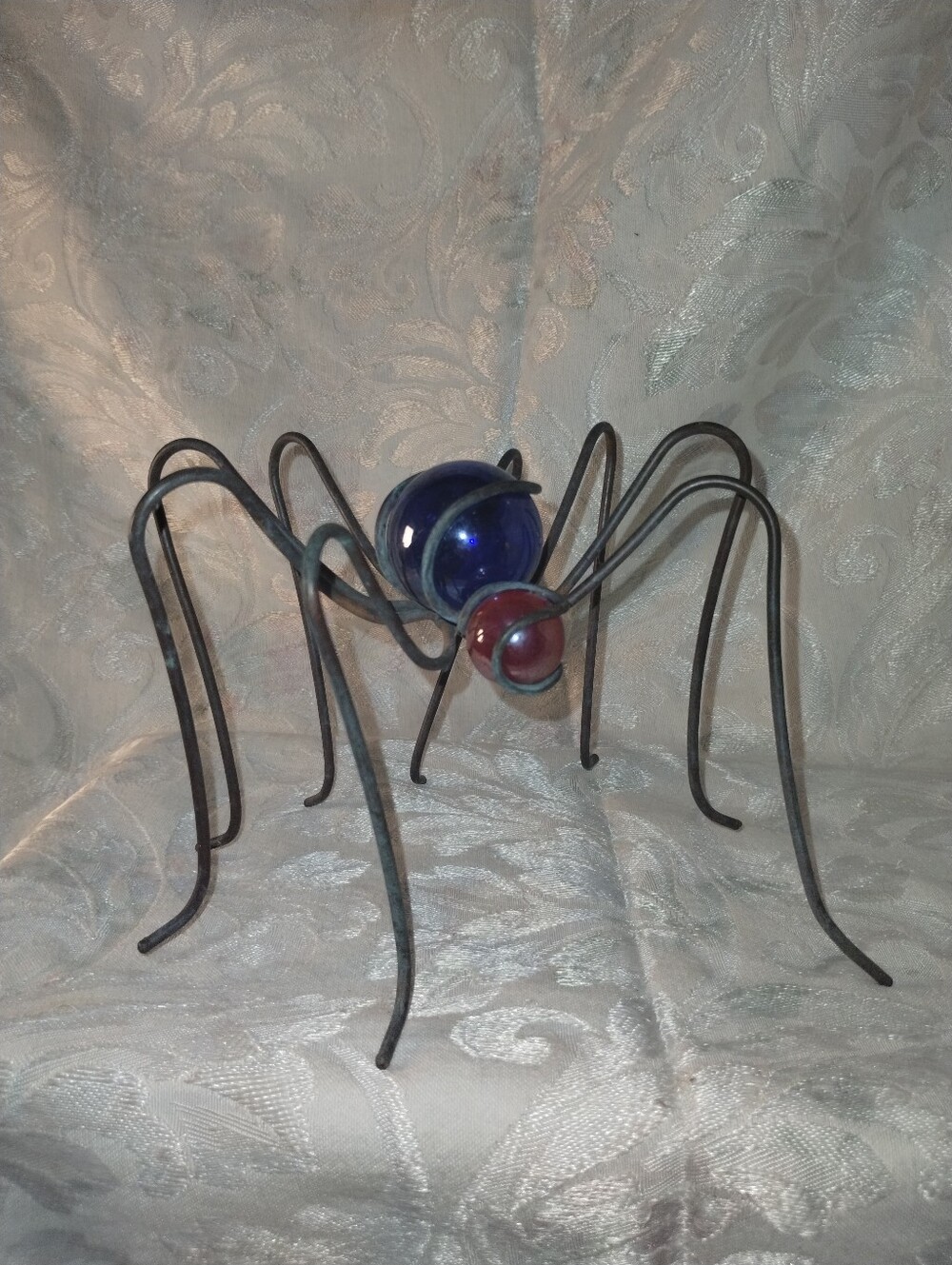 Handcrafted Metal Spider Sculpture with Blue and Red Glass Orbs / 5" X 7"